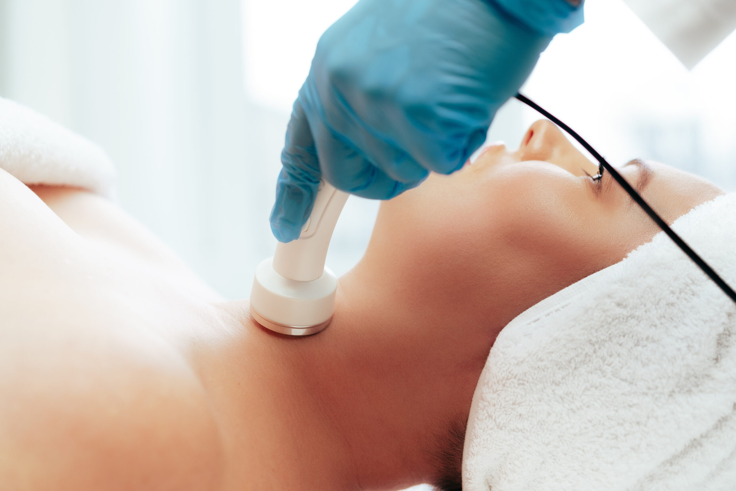 A young lady getting midas Signature Bridal Facial from cosmetologist