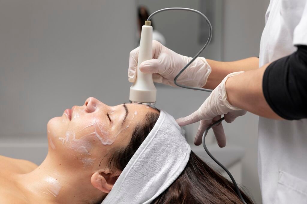 young-woman-having-facial-treatment-1024x682 mnrf for open pores, uneven texture, and pigmentation